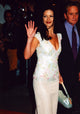 Catherine Zeta-Jones waving in a cream skirt and floral top photo print