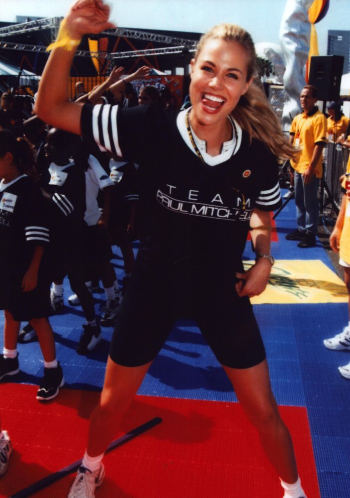 Brooke Burns working out in a Paul Mitchell shirt photo print