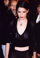 Neve Campbell in a black sheer striped outfit photo print