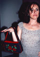 Molly Shannon holding a floral purse photo print.