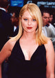 Photo print of Charlotte Ross wearing a black dress with hand on hip.