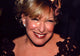 Bette Midler close-up photo print in lace top with bow.