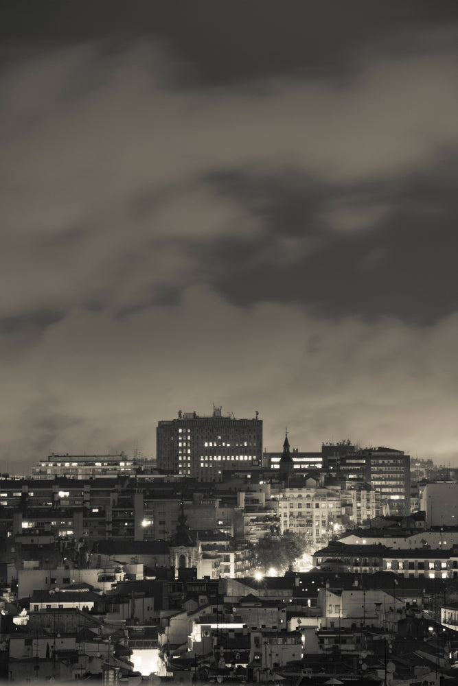 High angle view of Madrid cityscape at dusk, city lights.