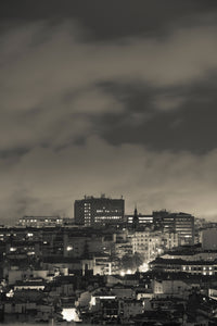 High angle view of Madrid cityscape at dusk, city lights.