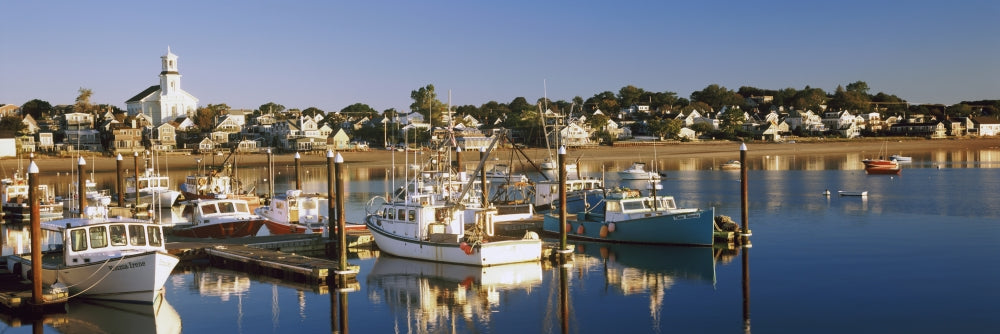 Boats at a Harbor in Provincetown, Cape Cod Poster Print showcasing vibrant boats and coastal scenery.