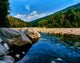 Swift River flowing through a lush forest along Kancamagus Highway in New Hampshire poster print.
