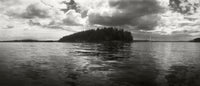 Island in the Pacific Ocean against a cloudy sky - San Juan Islands, Washington State poster print.