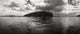 Island in the Pacific Ocean against a cloudy sky - San Juan Islands, Washington State poster print.