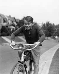 1930s Smiling Boy Riding Bicycle Vintage Poster Print