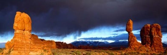 Thunderstorm Over Arches National Park Poster Print showcasing dramatic clouds over iconic arches.