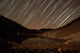 Star trails over Taar Lake art print by Amin Jamshidi featuring a night sky.