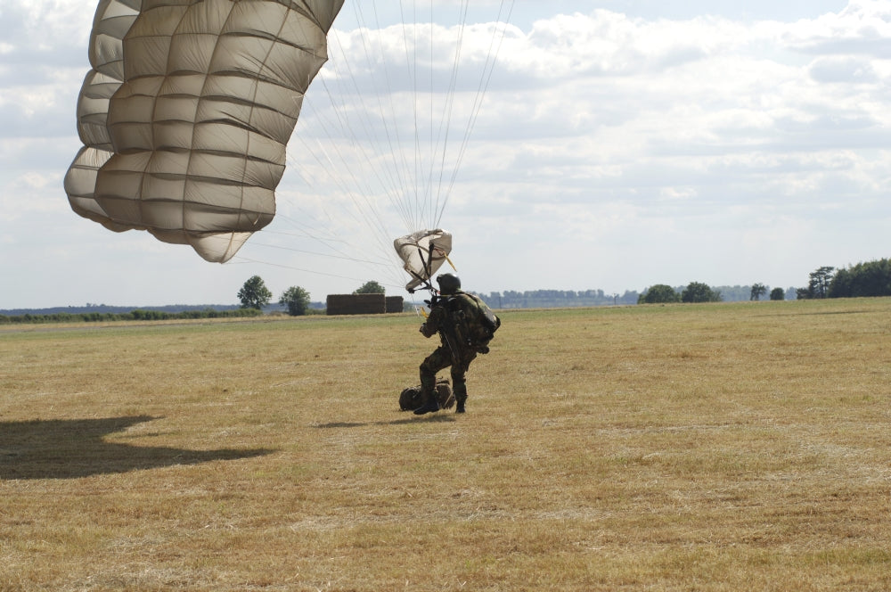 Pathfinder Platoon member collapsing parachute after HALO jump poster print.