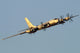 Tu-95MSM strategic bomber with X-101 missiles performing test flight poster print.