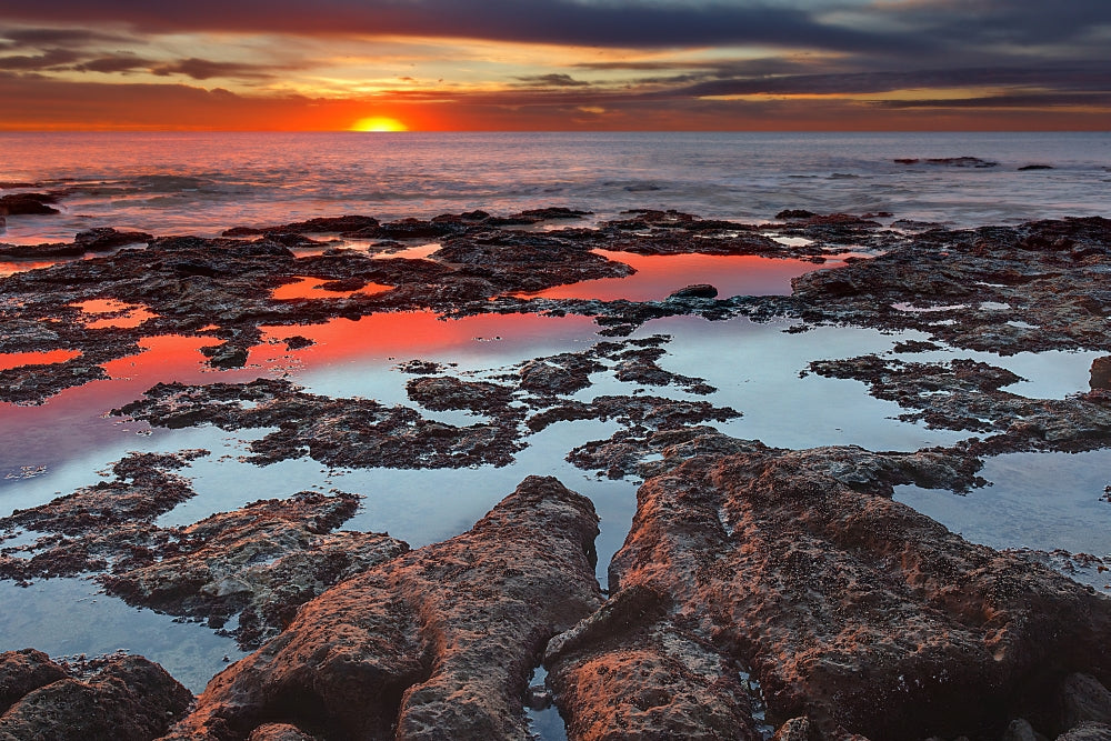 Tidal Pools at Sunrise Poster Print showcasing vibrant colors and reflections in Miramar, Argentina.