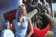 Classic 1940's pin-up girl in front of vintage F3F biplane poster print.