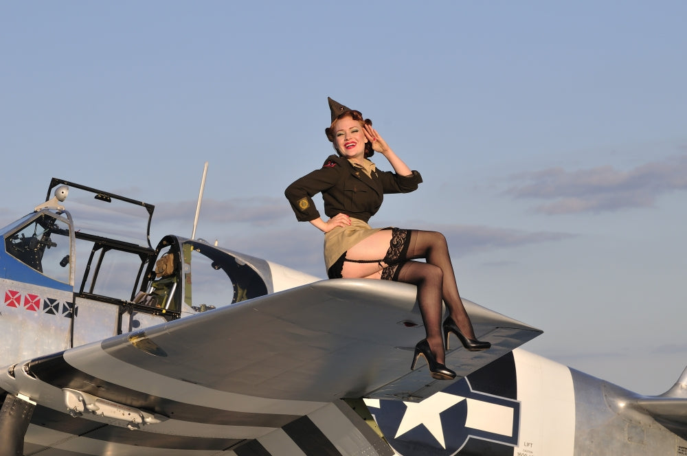 Pin-Up Girl Sitting on P-51 Mustang Fighter Plane Poster Print