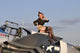 Pin-Up Girl Sitting on P-51 Mustang Fighter Plane Poster Print