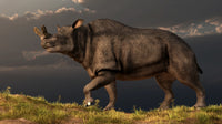 Brontotherium walking atop a grassy hill poster print.