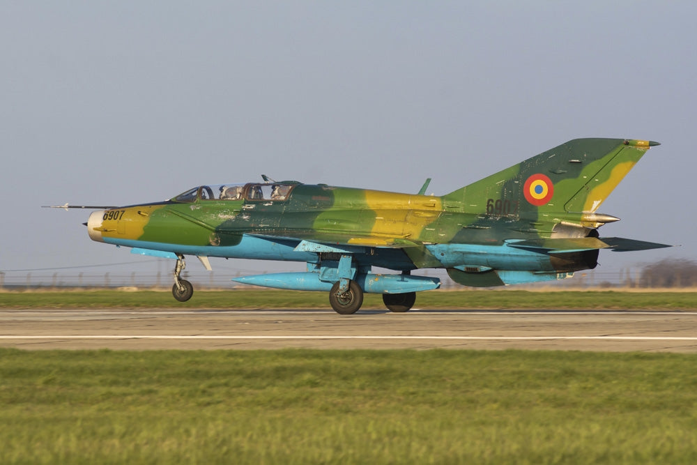 MiG-21UM Lancer-B landing at an airbase in Romania poster print.