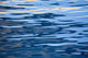 Sunset Reflection Abstract Art Print by David Fleetham showcasing vibrant colors on calm ocean waters.