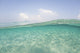 Sunlight rippling across a shallow sand flat in Indonesia poster print.