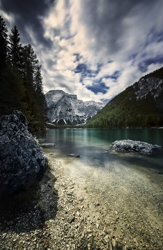 Lake Braies and Dolomite Alps poster print showcasing stormy clouds in Northern Italy