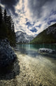 Lake Braies and Dolomite Alps poster print showcasing stormy clouds in Northern Italy