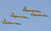 Royal Moroccan Air Force F-5 planes flying at Marrakech Air Show poster print.