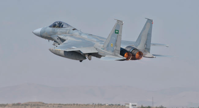 Royal Saudi Air Force F-15 in flight poster print over Spain.