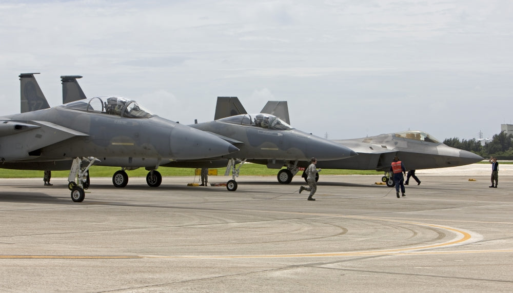 F-15 and F-22 aircraft at Kadena Air Base during pre-flight checks poster print