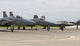 F-15 and F-22 aircraft at Kadena Air Base during pre-flight checks poster print