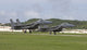F-15 fighter jets taking off in formation at Kadena Air Base, Okinawa, Japan.