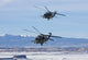 Two HH-60G Pave Hawk helicopters flying in formation during training.