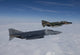 Poster of two QF-4E aircraft flying over the Gulf of Mexico