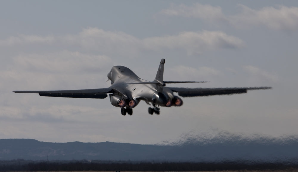 B-1B Lancer taking off at sunset from Dyess Air Force Base, Texas poster print.