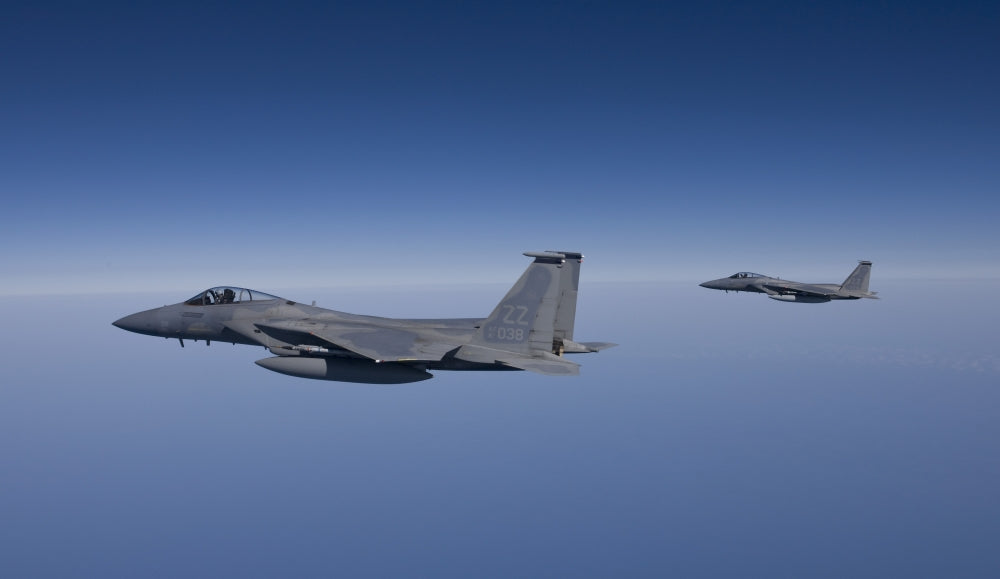 Two F-15 Eagles flying over the Gulf of Mexico poster print