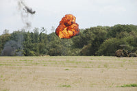 Belgian Paratroopers Under Attack Poster Print showcasing military action.