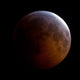 Lunar Eclipse Poster Print featuring a dramatic cosmic view