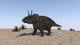 Triceratops Walking Across a Barren Landscape Poster Print