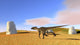 Utahraptor running across a grassy field poster print.
