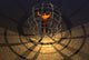 A Human Figure Trapped in a Prison Cage Poster Print showcasing a figure in confinement.