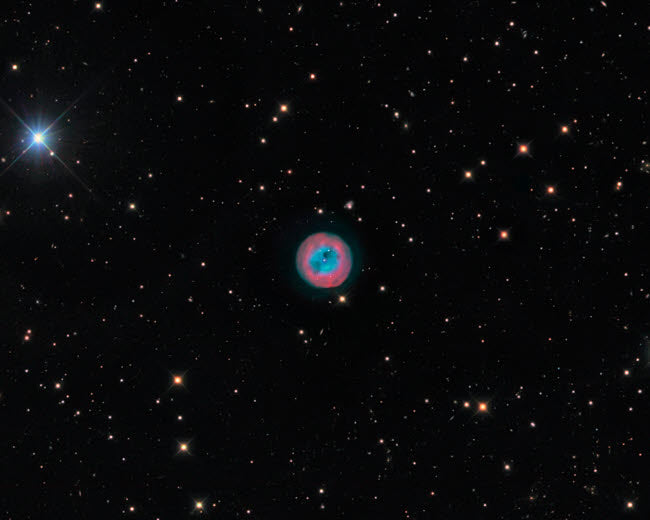 The Owl Nebula Poster Print showcasing vibrant cosmic colors and details.