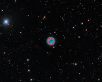 The Owl Nebula Poster Print showcasing vibrant cosmic colors and details.