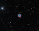 The Owl Nebula Poster Print showcasing vibrant cosmic colors and details.