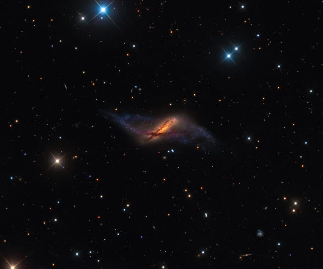 NGC 660 Polar Ring Galaxy Poster Print by Michael Miller showcasing the beauty of space.