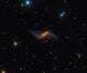 NGC 660 Polar Ring Galaxy Poster Print by Michael Miller showcasing the beauty of space.