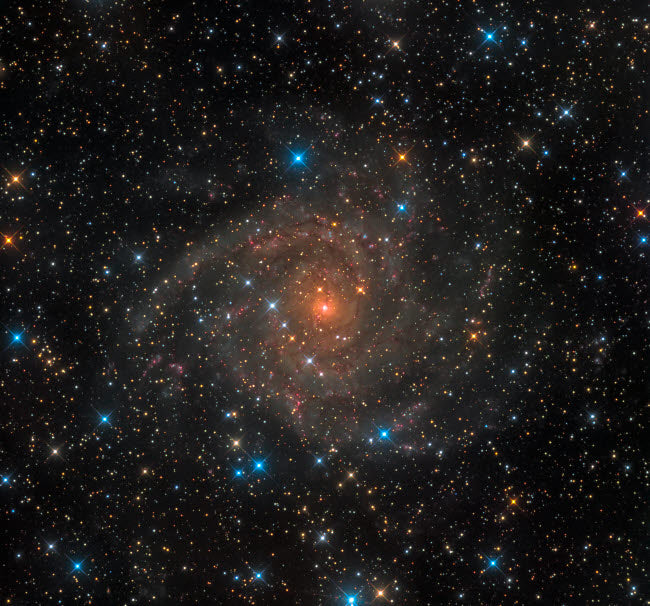 Intermediate Spiral Galaxy IC 342 Poster Print by Michael Miller showcasing vibrant cosmic details.