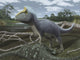 Cryolophosaurus standing over its prey poster print depicting a dinosaur.