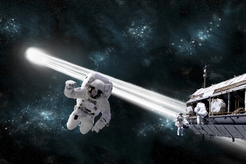 Astronaut floating in outer space with fellow astronauts working on a space station and a comet passing by.