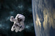 Astronaut floating in space poster print with Earth-like planet.